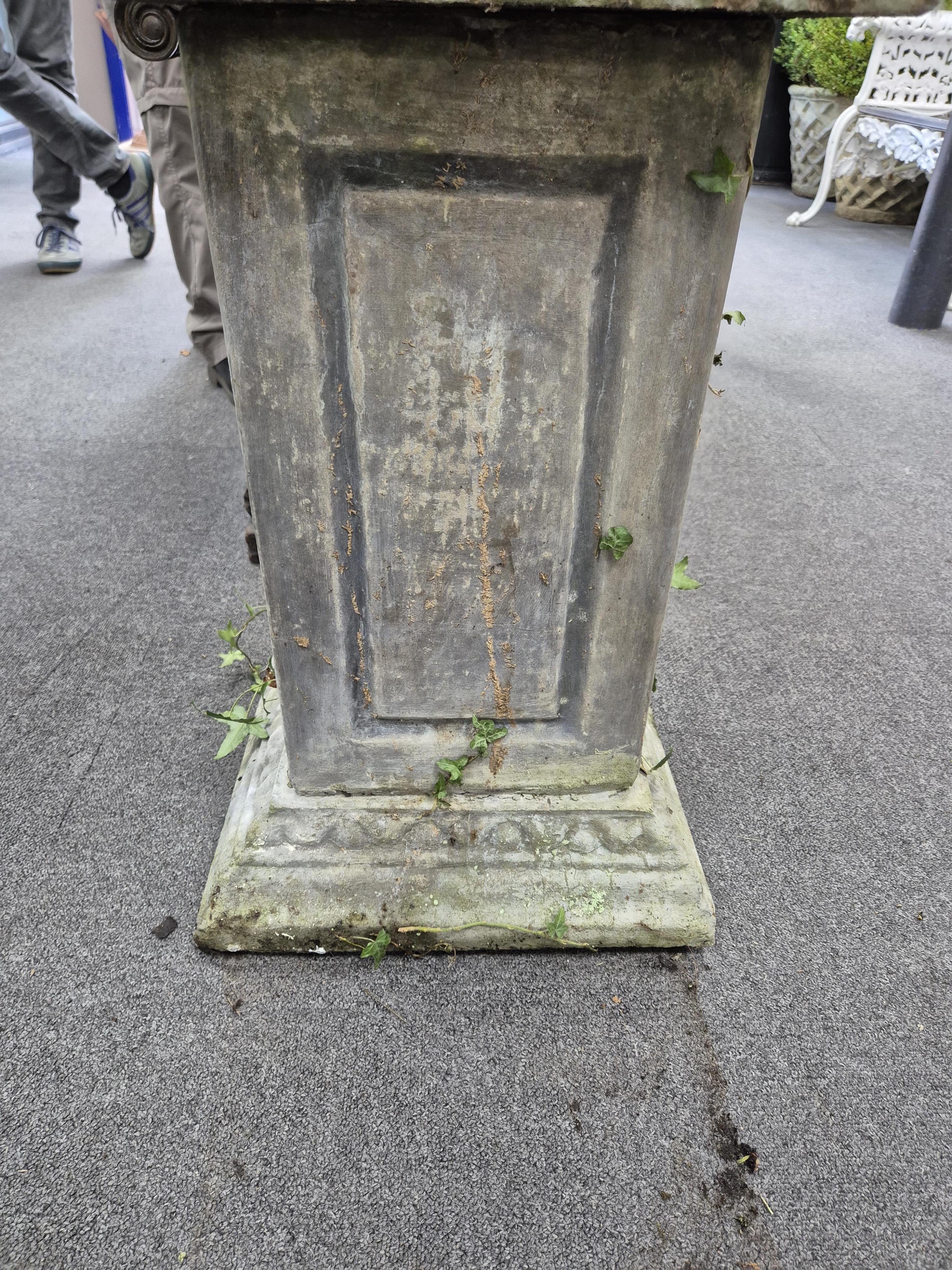 A large reconstituted stone garden vase